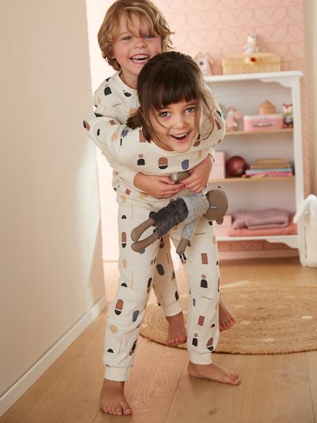 Pijama con un lado con estampado geométrico para niño crudo 